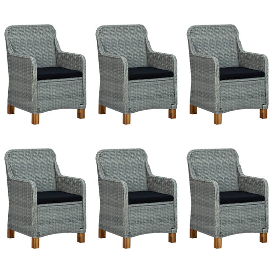 A view of the dining set, highlighting its removable black cushions and elegant design.
